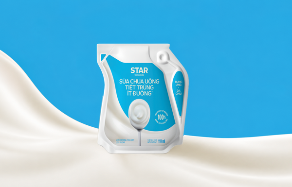 Vinamilk STAR UHT Drinking Yogurt Less Sugar in an Ecolean Air Aseptic package, standing on a white wave of yogurt against a light blue background.